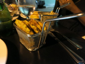 Plantains in mini fry baskets.