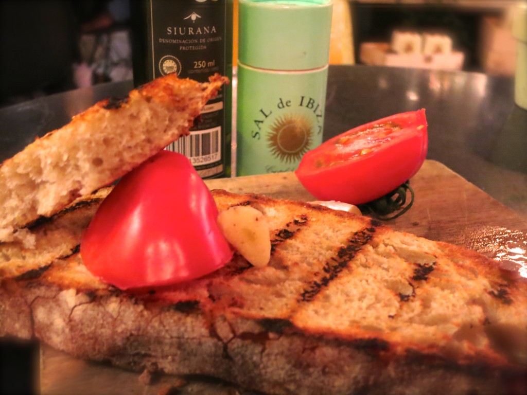 Catalan bread and olive oil with tomatoes, and sea salt. Delish!